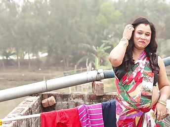 Watch this Indian beauty with a stunning assets take it hard in rear end fashion on the rooftop