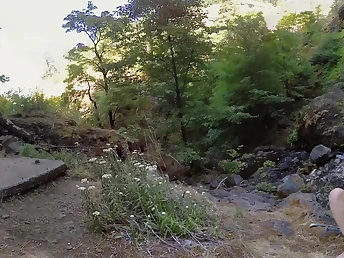 Naked cookie outdoors masturbates fingering her shaved vagina